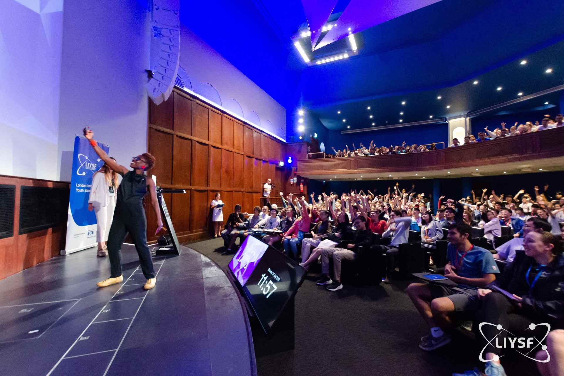 Students raising hands during an interactive lecture session at LIYSF 2019