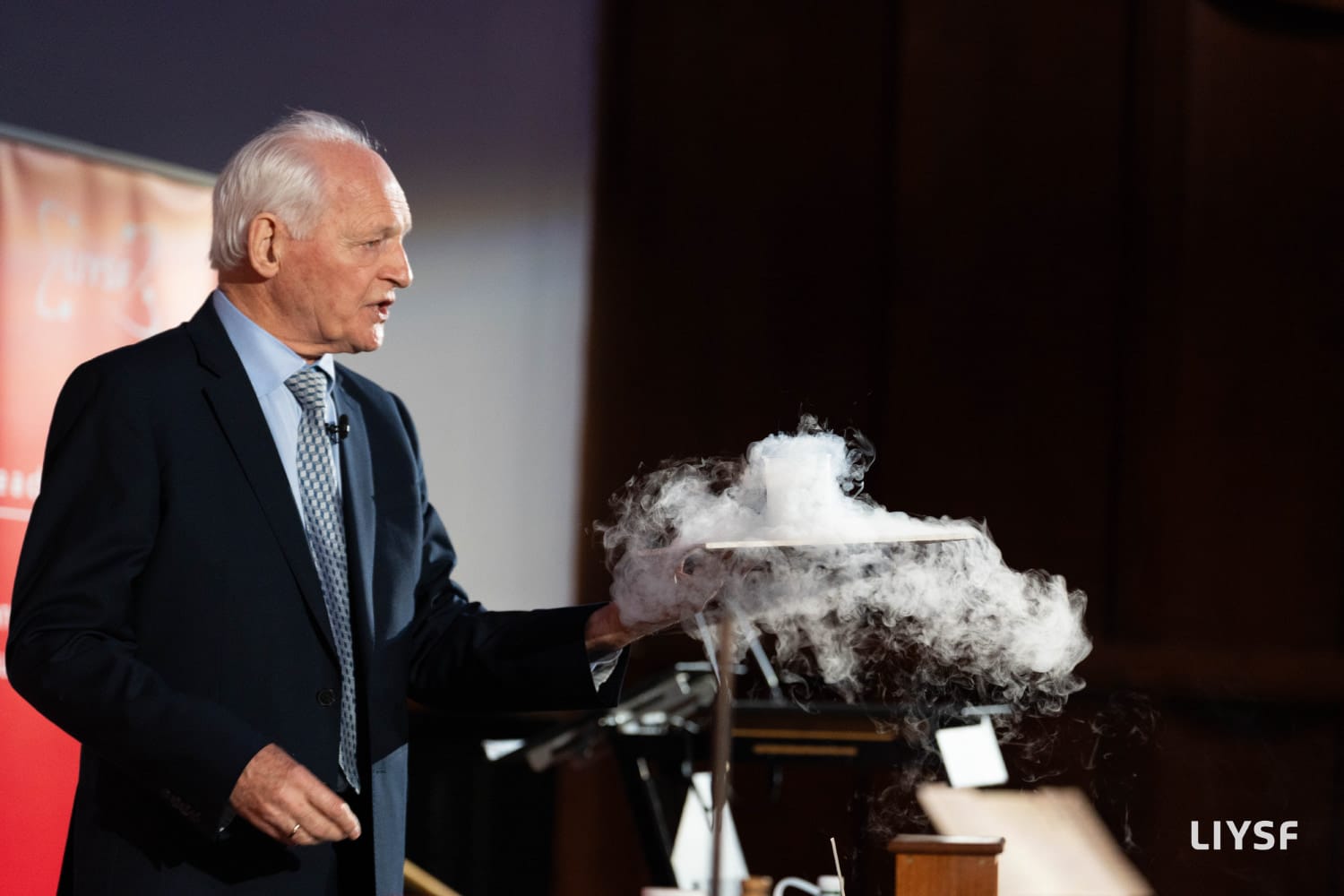 Chemistry demonstration during a principal lecture at the 66th LIYSF 2025 featuring a dry ice experiment on stage