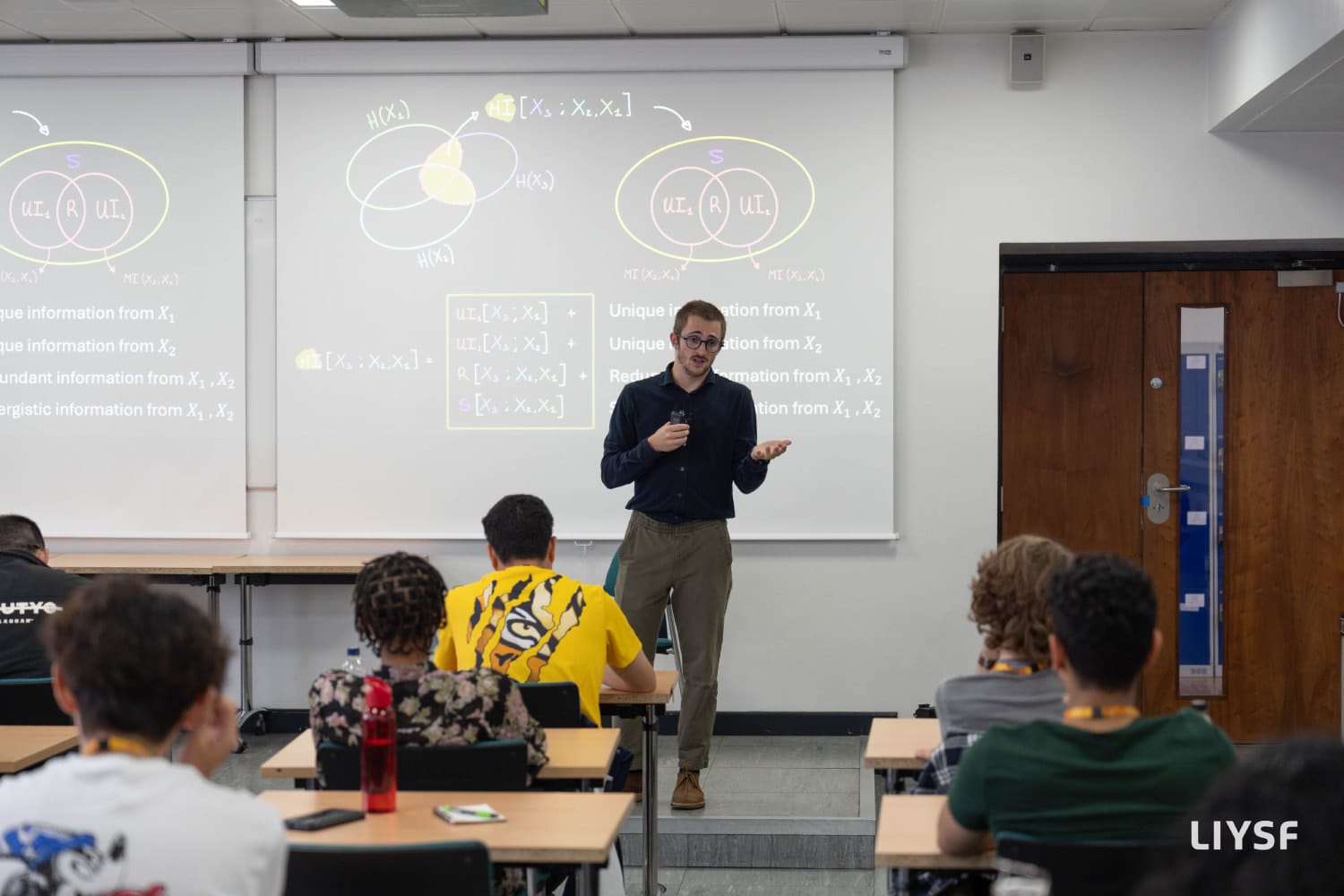 Principal lecture classroom session at the 66th LIYSF 2025 covering information theory concepts with students engaged in discussion